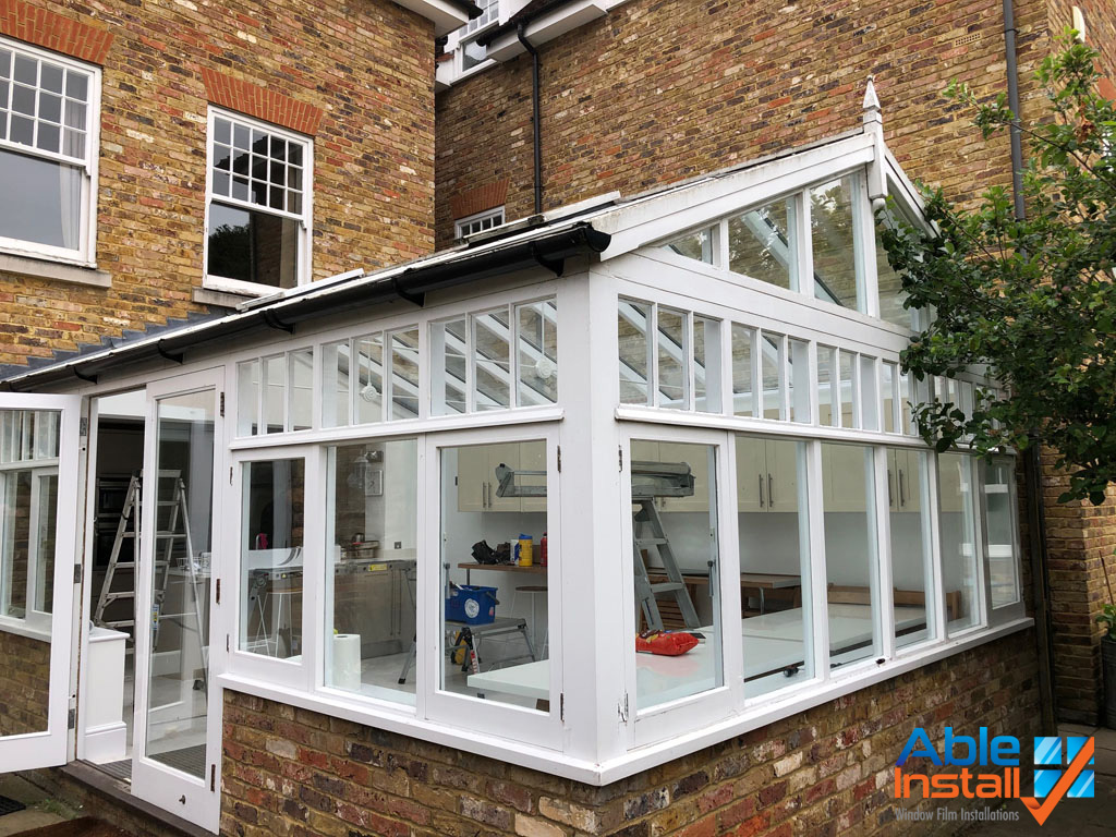 Outside view of large extension with glass roof